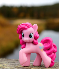 Pinkie Pie on a Bridge Railing